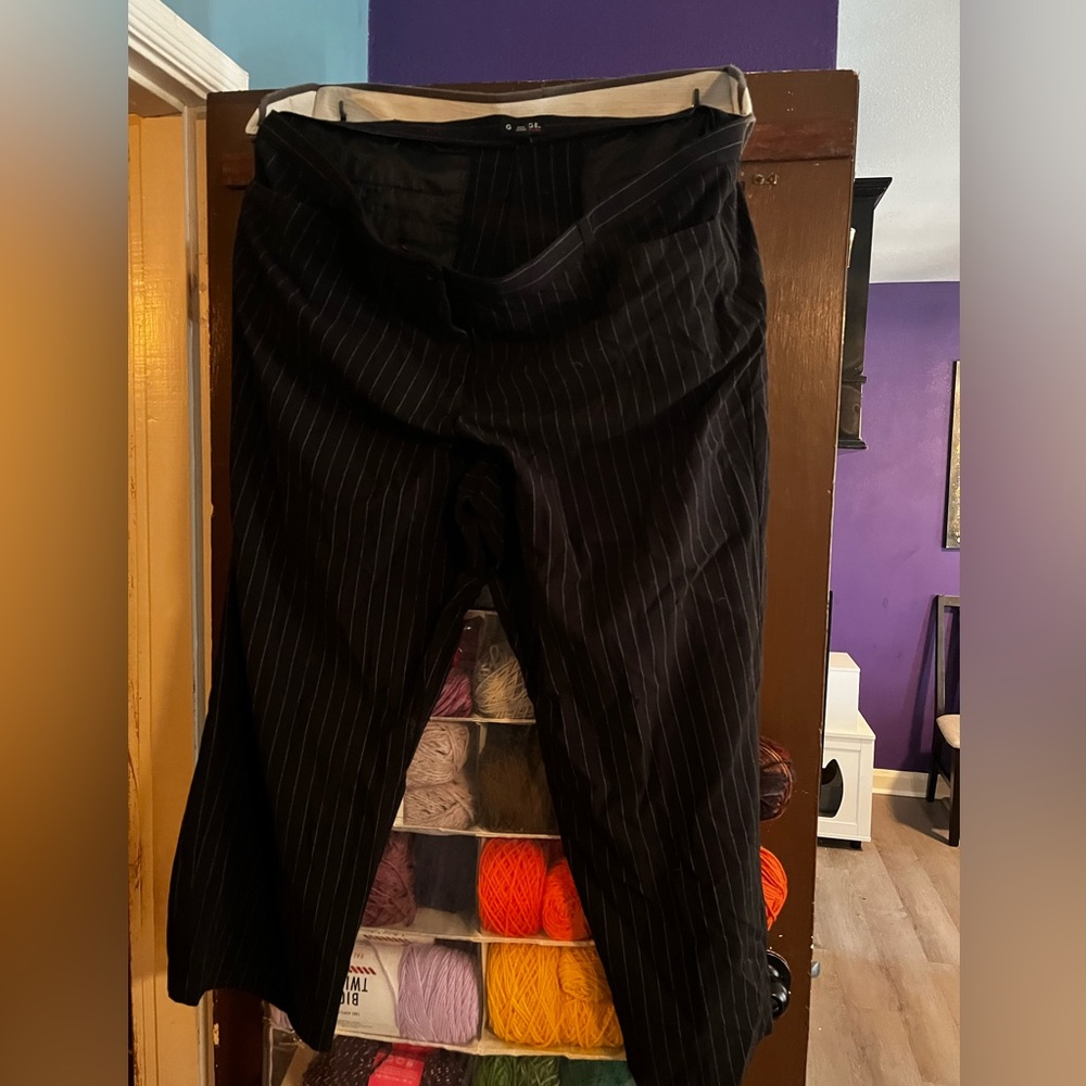 Black slacks with white pin stripes